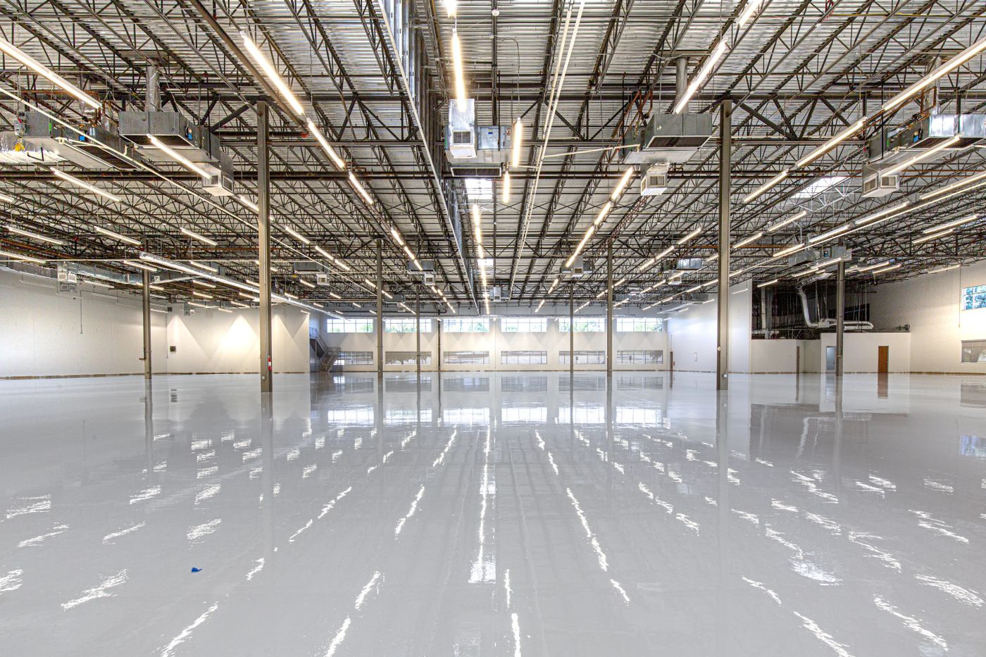 Completed high-gloss concrete flooring in a large commercial facility