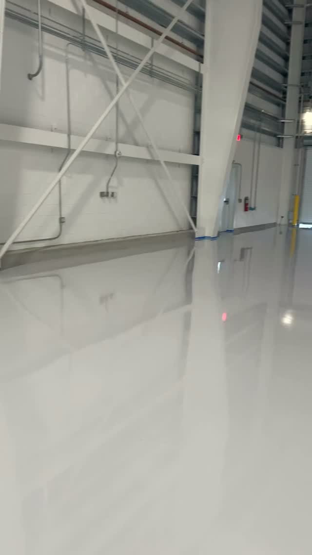 Light gray high-performance floor inside an aircraft hangar
