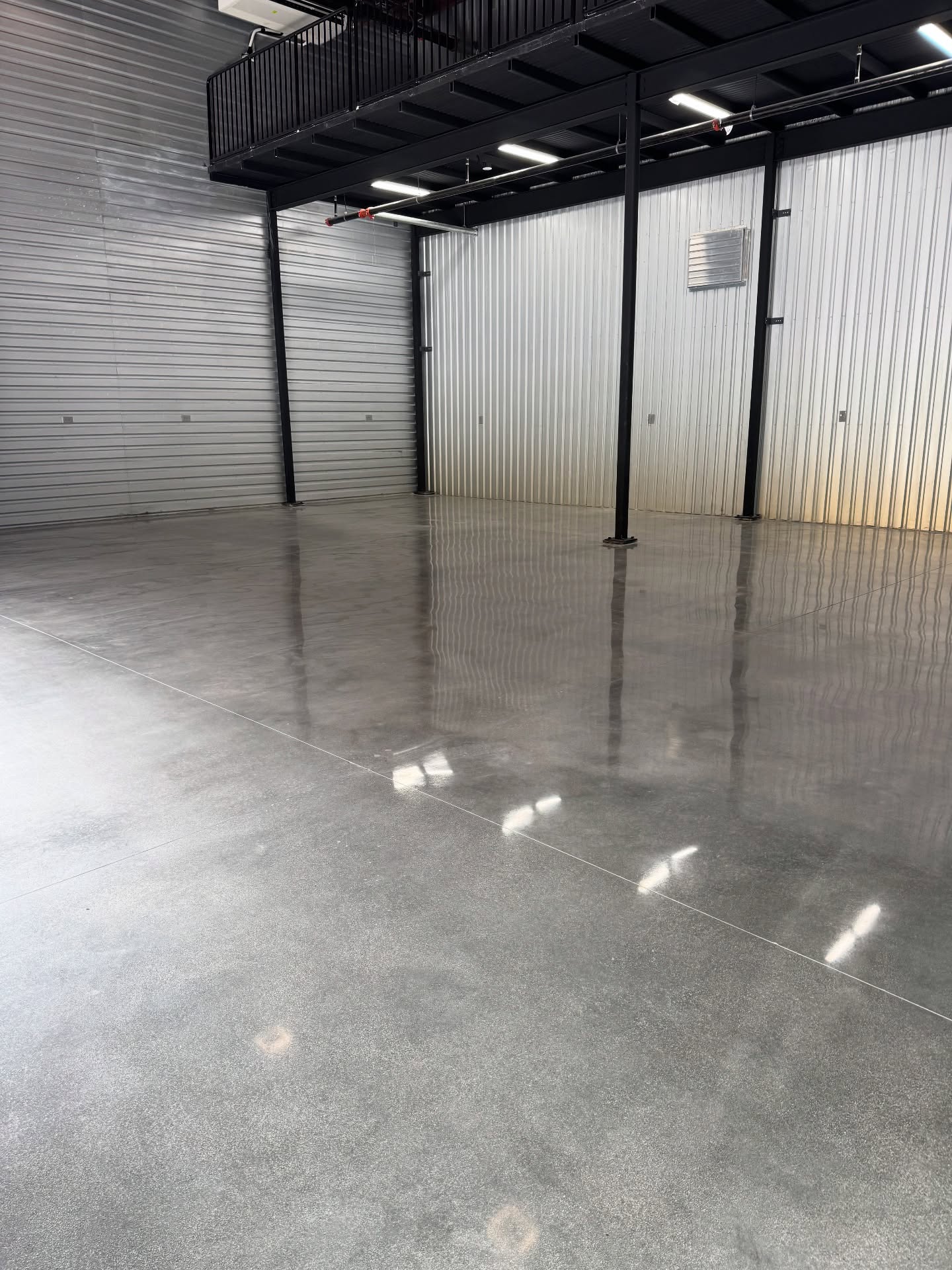 Polished concrete floor inside a steel mezzanine building