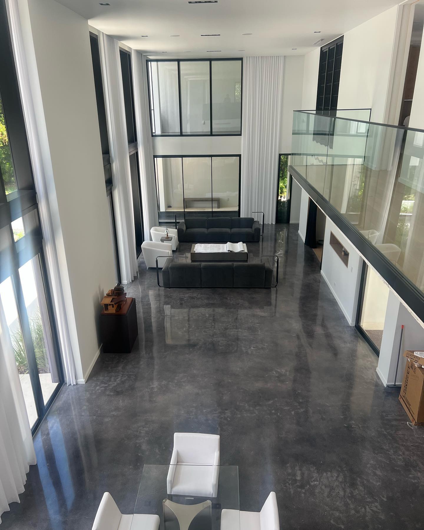 Dark metallic floor throughout a bright modern residential interior